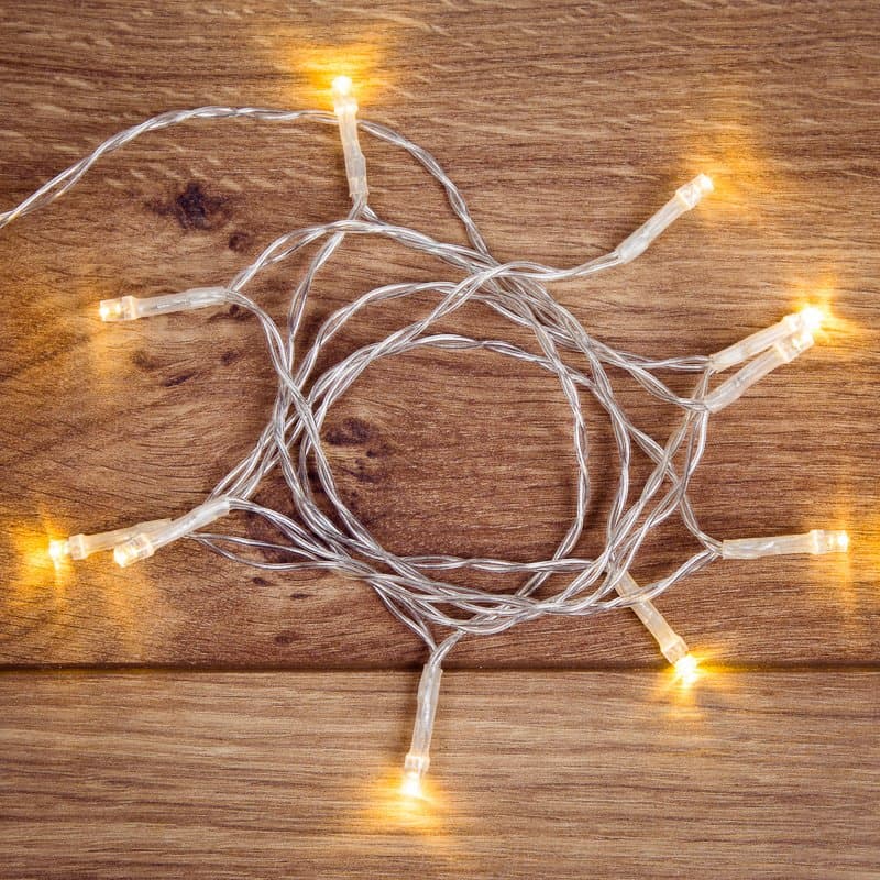 NEON-NIGHT Гирлянда светодиодная универсальная 10 LED, 1,2 метра, прозрачный ПВХ, теплое белое свечение, батарейки 2хАА 303-073